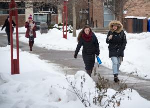 Students walking across a snowy Buffalo State campus