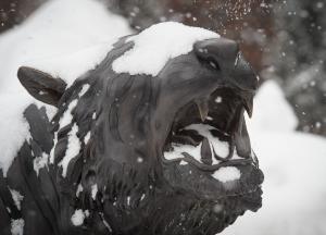 Bengal statue with eyes covered in snow