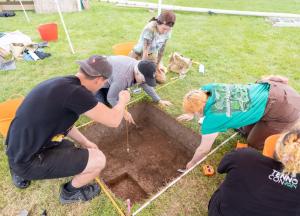 Field school participants excavating 