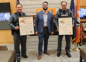 University Police Department officers James Urbanski and Anthony Olszewski were recognized with proclamations from New York State Assemblyman Jon Rivera during a ceremony earlier this week at the Jacqueline Vito LoRusso Alumni and Visitor Center.