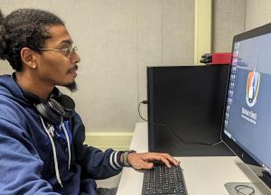 Buffalo State student using a computer