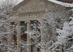 Rockwell Hall through snow-covered trees