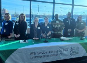 Members of the panel posed behind a table