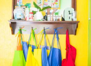 Colorful aprons hanging in a row