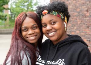 Two smiling Buffalo State students pose for the camera